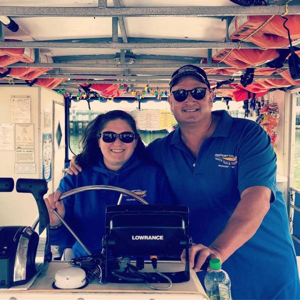 Man and woman behind taxi controls