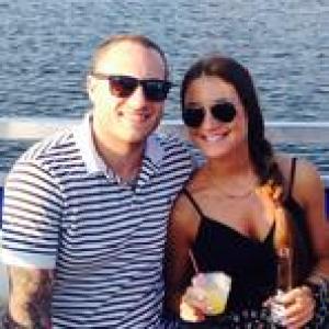 Man and woman posing for photo