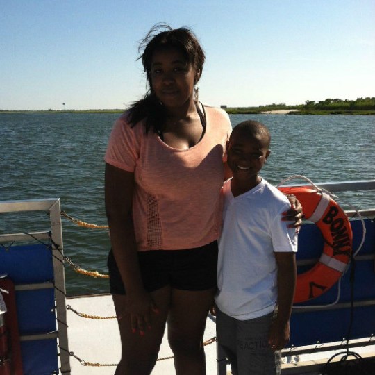 Woman and boy posing for photo