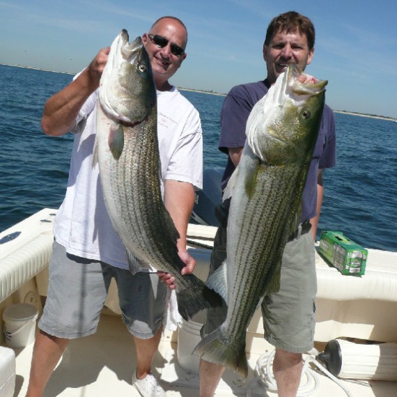 Two men with large fish