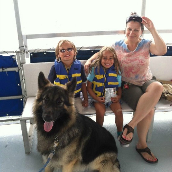 Group posing for a photo with dog