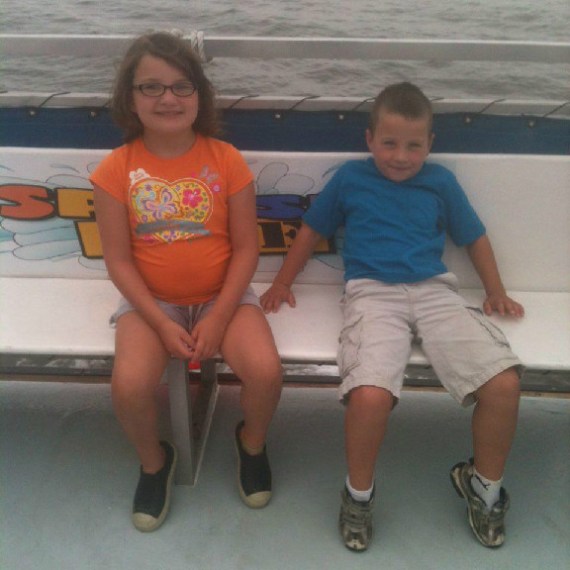 Two kids sitting on the boat